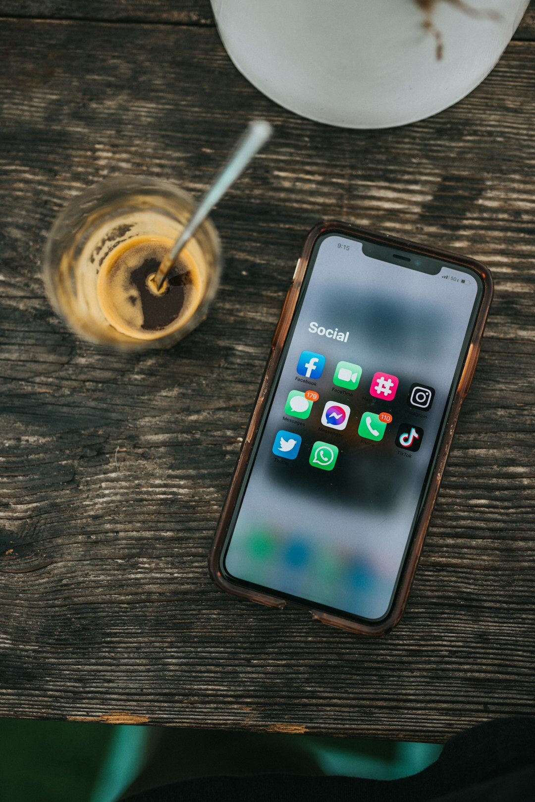 Close-up of a smartphone screen displaying social media apps